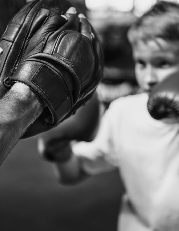 Boy Boxing Training Punch Mitts Exercise Concept